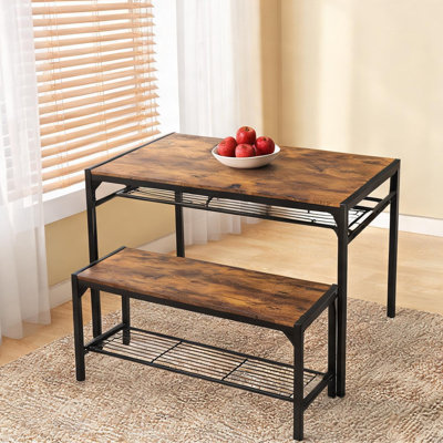 Ensemble de table et de chaises de salle à manger combinant des détails en bois massif (43,3 x 25,6 x 29,9 pouces), un espace de rangement et une structure en métal.