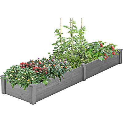 Grande boîte à fleurs surélevée avec jardin