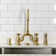 Kingston Brass English Country Two-Handle 3-Hole Deck Mount Bridge Kitchen Faucet with Side Sprayer
