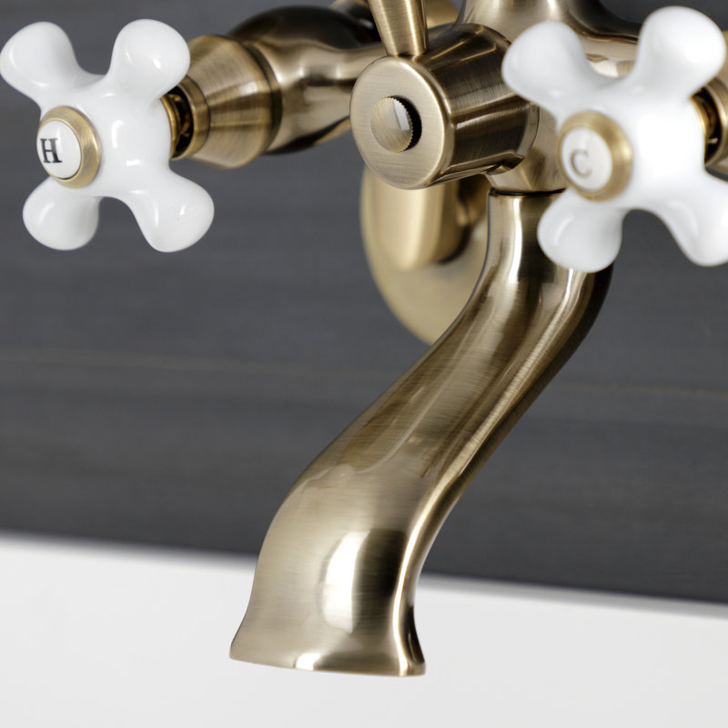 Kingston Brass Kingston Three-Handle 2-Hole Wall Mount Clawfoot Tub Faucet with Hand Shower, Antique Brass