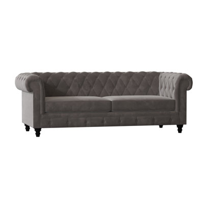 Canapé Chesterfield à accoudoirs roulés