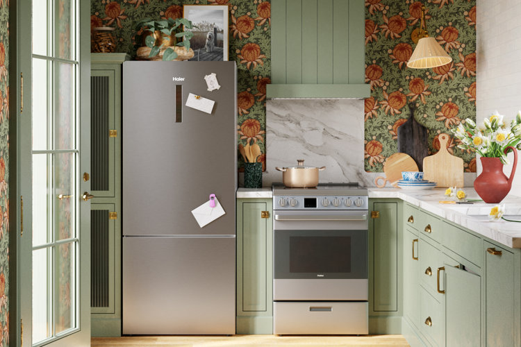 green kitchen with floral wallpaper and a bottom-freezer refrigerator