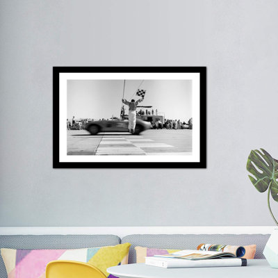 " 1960s Man Jumping Waving Checkered Flag For Winning Sports Car Crossing The Finish Line " by Vintage Images