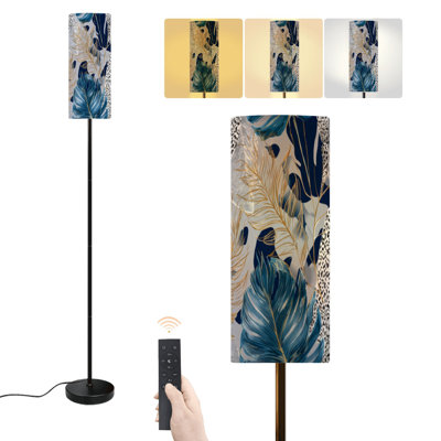 Lampe sur pied bleu marine à motif de feuilles dorées, inspirée du feuillage tropical de monstera et de palmier. Lampe sur pied moderne à intensité variable avec télécommande et interrupteur au pied. Abat-jour haut, idéal pour le salon, la chambre à coucher ou le bureau.