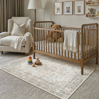 Tapis oriental beige Stella avec envers antidérapant et rouleau
