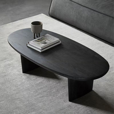 Table basse noire en bois massif ovale