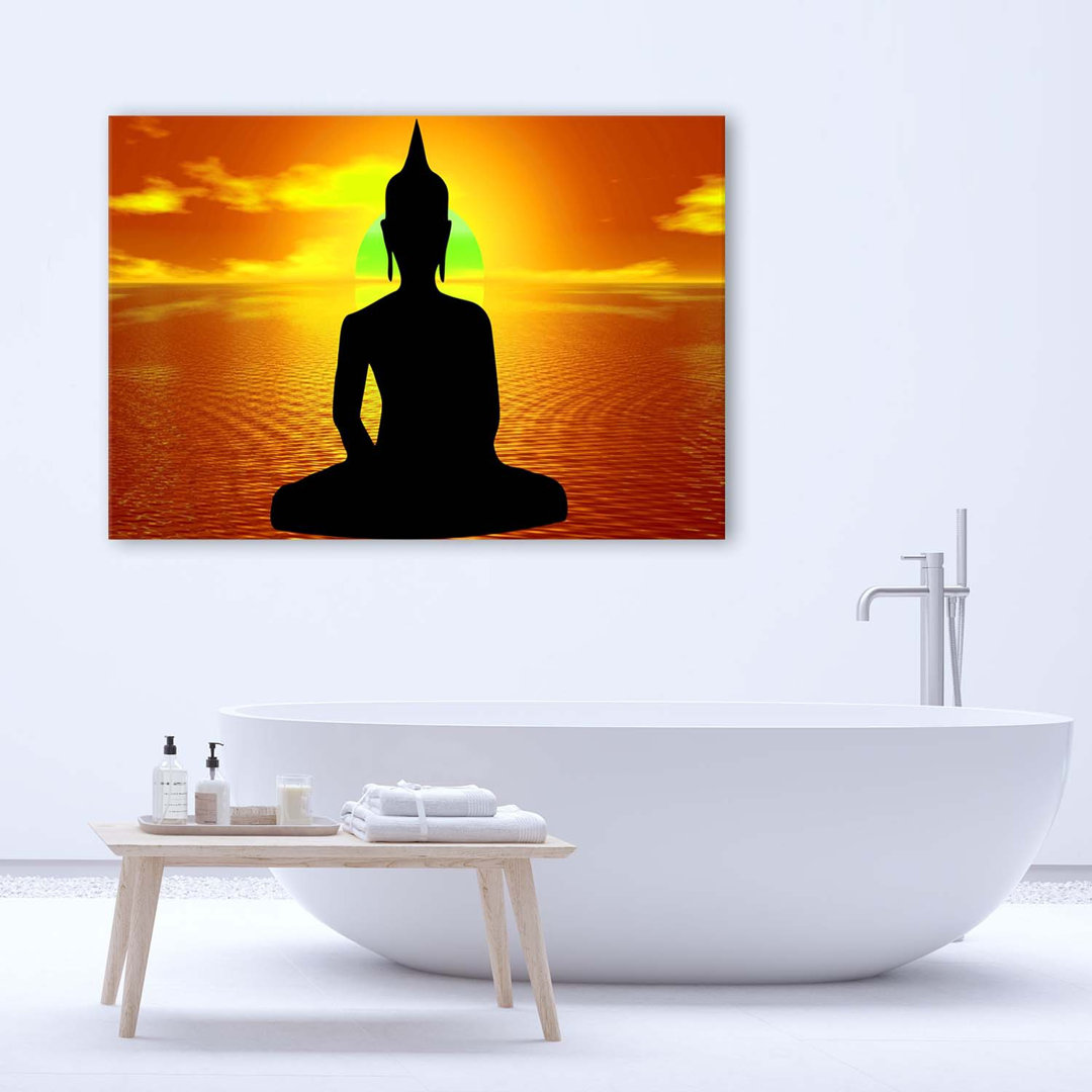 Leinwandbild Buddha meditiert bei Sonnenaufgang