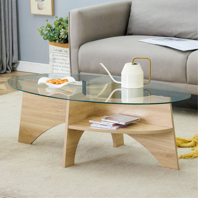 Table basse ovale en verre trempé - Conception multifonctionnelle de 41,3 po x 23,6 po. Plateau de table ovale. Pied de table en forme d'éventail diagonale couleur bois naturel. Convient pour les salles à manger, les salons et les bureaux.