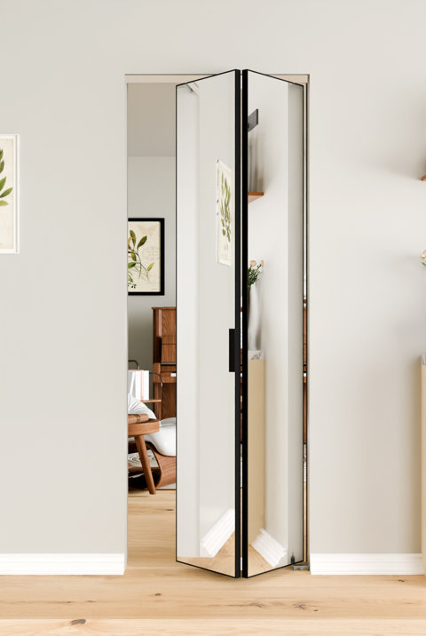 Modern floor-to-ceiling interior bifold glass door with a slim black frame installed in a neutral wall.