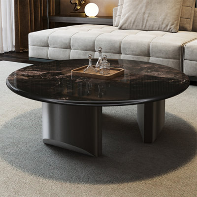 Simple round supercrystalline stone coffee table by Creature B Comforts