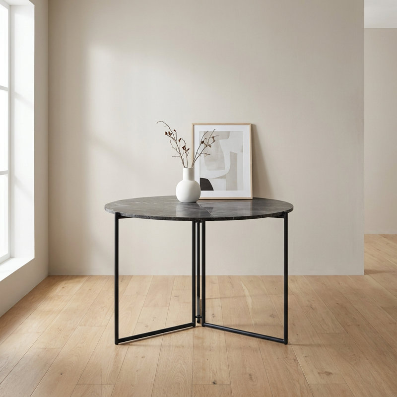 Table de salle à manger ronde moderne avec piètement géométrique en métal
