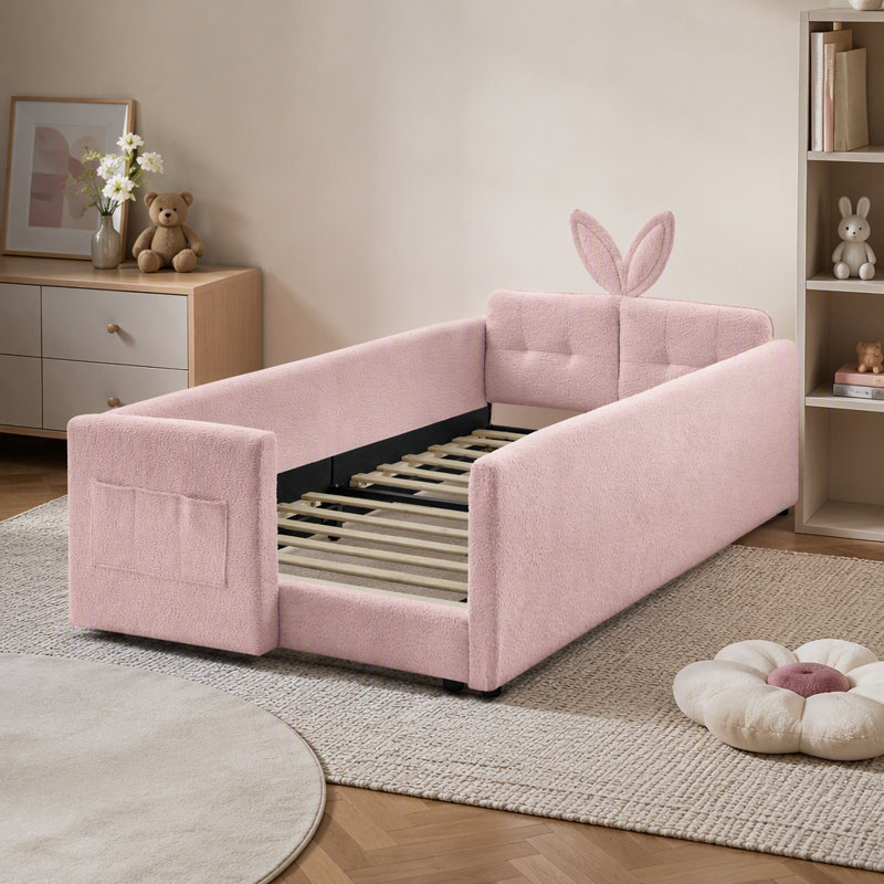 Lit plateforme tapissier simple avec tête de lit en forme d'oreille de lapin, avec barrière de sécurité et poche, tissu bouclé, rose
