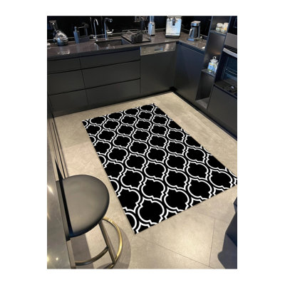 Tapis décoratif moderne à motif géométrique noir à motif géométrique