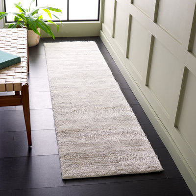 Tapis ivoire / gris clair en polyester tissé à la machine Idhika