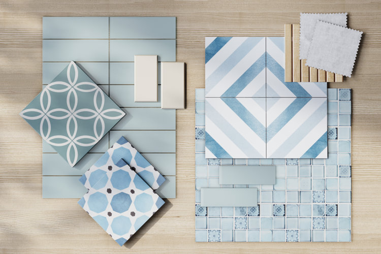 flat lay display of patterned tiles on light hardwood flooring