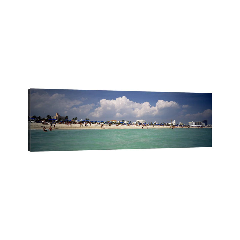 Tourists On The Beach, Miami, Florida, USA by Panoramic Images - Wrapped Canvas Panoramic Print