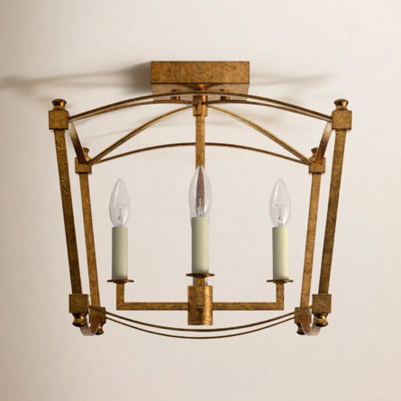 Gold semi-flush mount ceiling light with three candle-shaped bulbs