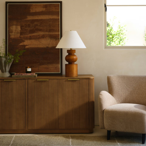 Living room interior with wood cabinet and framed art