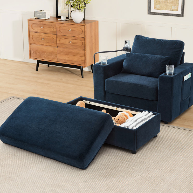Fauteuil bleu compact avec rangement amovible et dissimulé, port de chargement, porte-gobelets et poches latérales pour une utilisation en dortoir. Ports et espaces de rangement multifonctionnels.