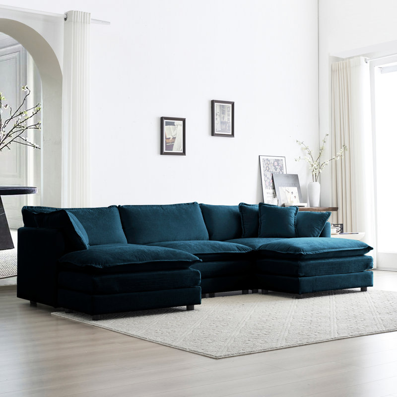Canapé d'angle en chenille bleue en forme de U, 5 places avec repose-pieds réversible et 2 poufs, structure en bois massif, revêtement de qualité et fabrication soignée.
