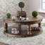 Rustic Style Round Wooden Coffee Table Antique Oak Finish supported Turned Legs And Open Shelf-1514272853