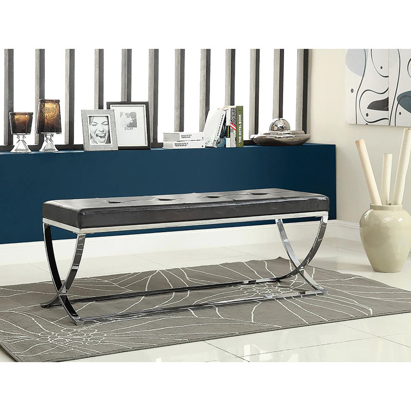 Élégant banc rembourré noir avec cadre pour l'intérieur et pieds élégants