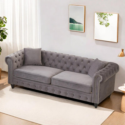 Canapé Chesterfield de salon avec accoudoirs roulés
