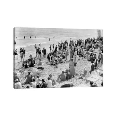 1920s Crowd Of People Some Fully Clothed Others In Bathing Suits On Palm Beach In Florida USA by Vintage Images - Wrapped Canvas Print
