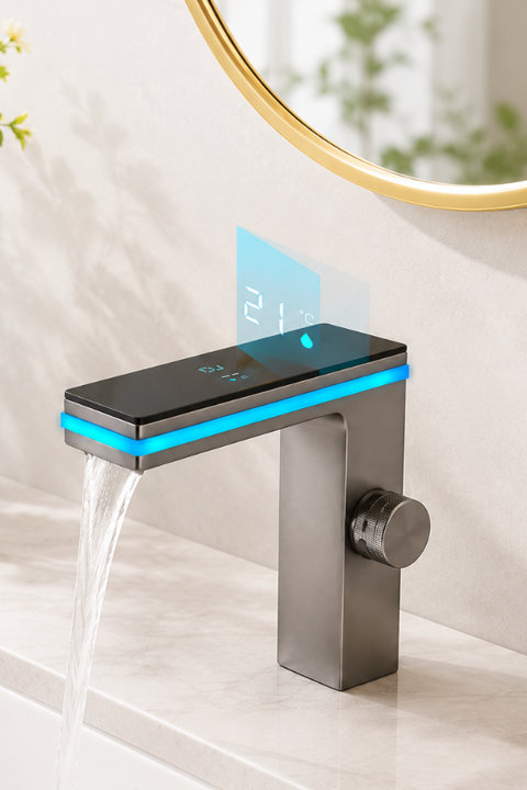 Modern matte black bathroom faucet with a digital temperature display, blue LED accent lighting, and a waterfall spout flowing into a sink.