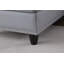 Canapé modulaire en faux cuir gris avec repose-pieds en L