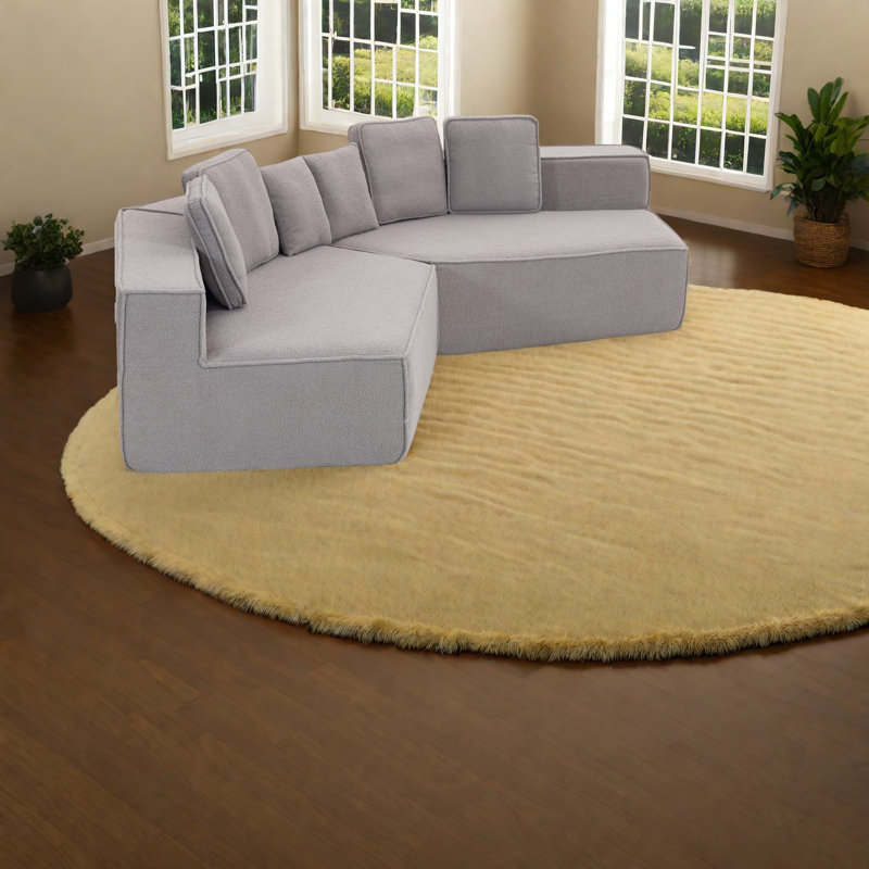 Canapé modulaire spacieux en velours gris moelleux