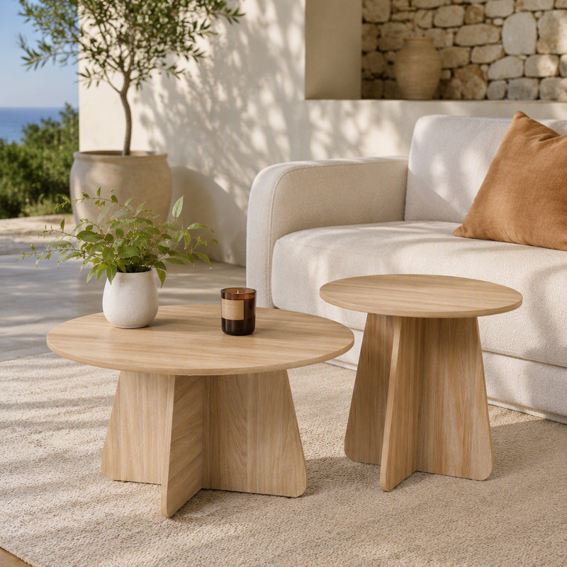 Retro-style nesting coffee table set. Available in walnut or natural wood finishes. Round nesting side tables with crisscross legs. Ideal for living rooms and dining rooms.
