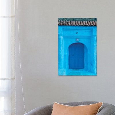 Africa, Morocco, Chefchaouen. Arch Over Wooden Door. by Jaynes Gallery - Wrapped Canvas Print