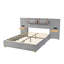 Grand lit plateforme tapissier en velours gris avec prises de courant et tablette de rangement