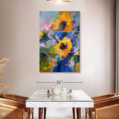 Harnek tournesols dans un vase bleu