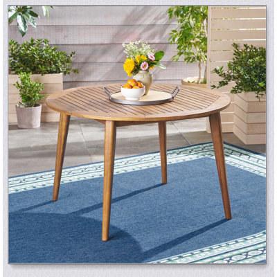 Table de salle à manger ronde en bois massif avec dessus à lattes pour une utilisation polyvalente à l'intérieur et à l'extérieur (terrasse).