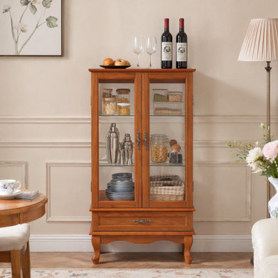 Vitrine lumineuse en verre avec tablettes réglables, deux portes et un tiroir pour la décoration et le rangement, idéale pour mettre en valeur des trésors