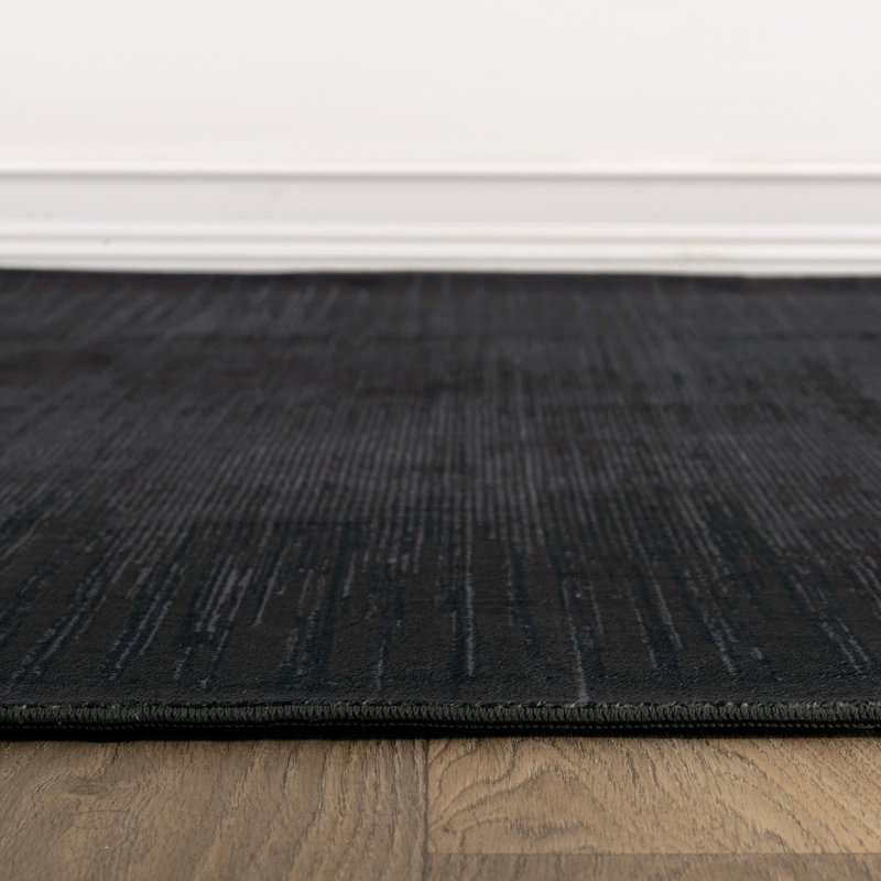Tapis uni uni noir chiné lavable à la machine, 6 pi 6 po x 9 pi