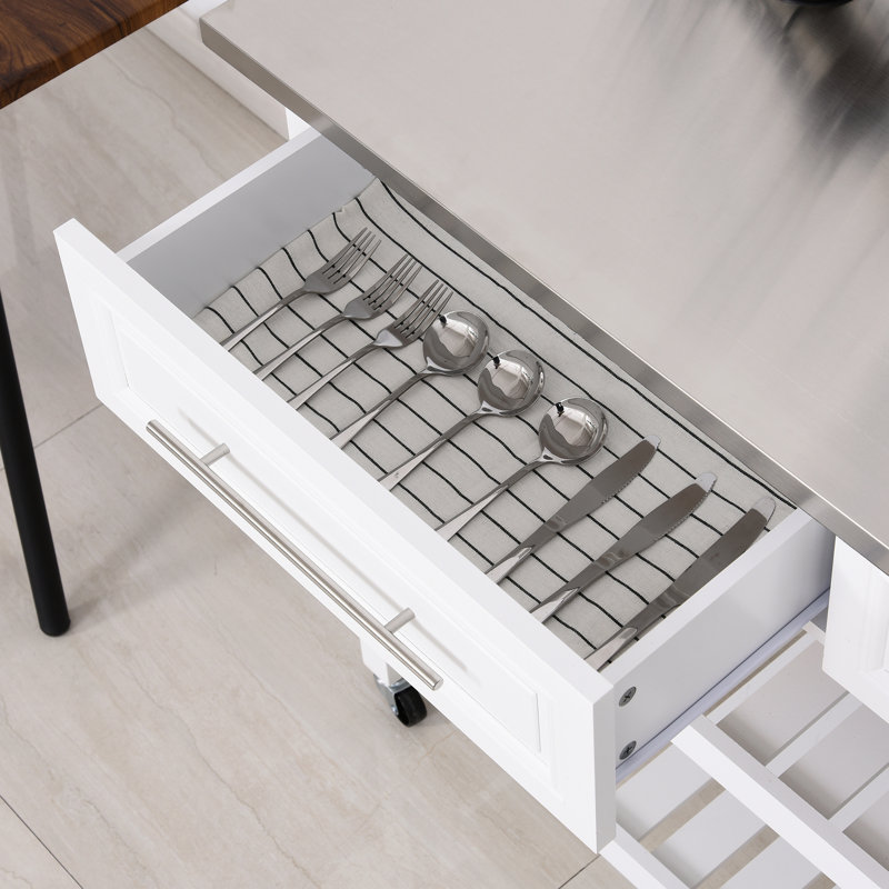 Îlot de cuisine avec plateau en acier inoxydable, tablettes ouvertes et tiroirs
