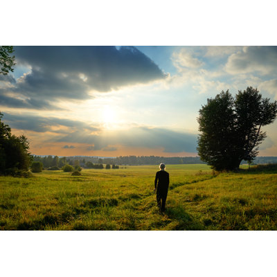 Man Fascinated by the Mystical Glow of the Sunset by Milos-Muller - Wrapped Canvas Photograph