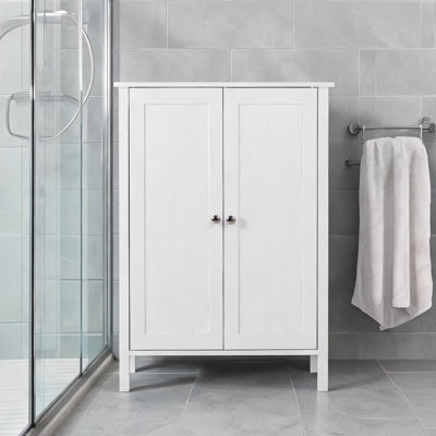 Meuble de salle de bain autoportant à double porte, trois étagères, structure en MDF, fini blanc éclatant, format compact de 60 cm de large.
