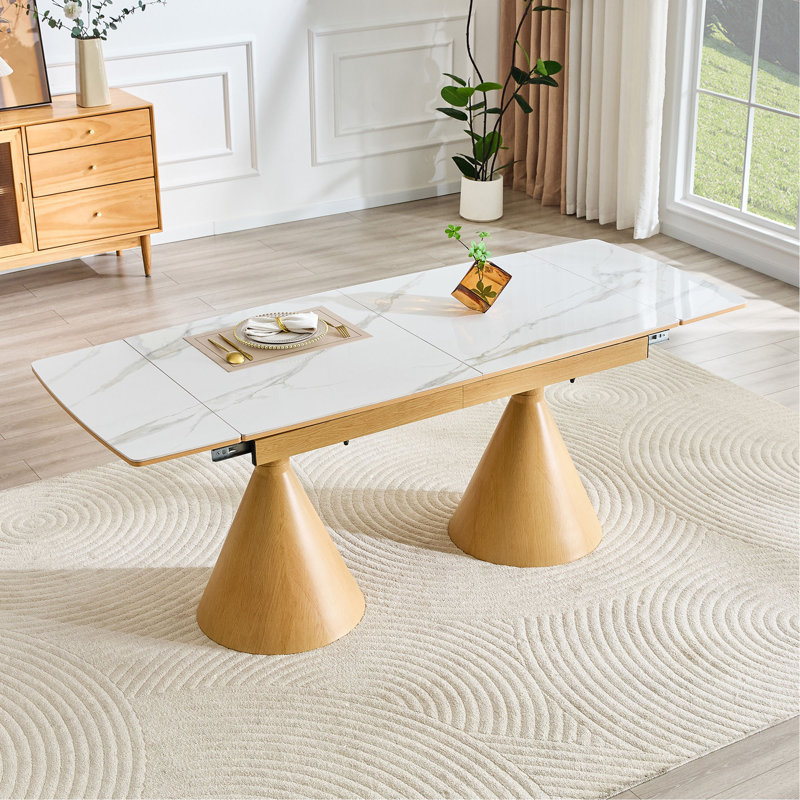 Table de salle à manger extensible avec plateau en pierre: plateau de table en marbre avec pieds fuselés en métal. Une table de salle à manger rectangulaire d'inspiration moderne et luxueuse pour la maison, pouvant accueillir de 4 à 8 personnes.