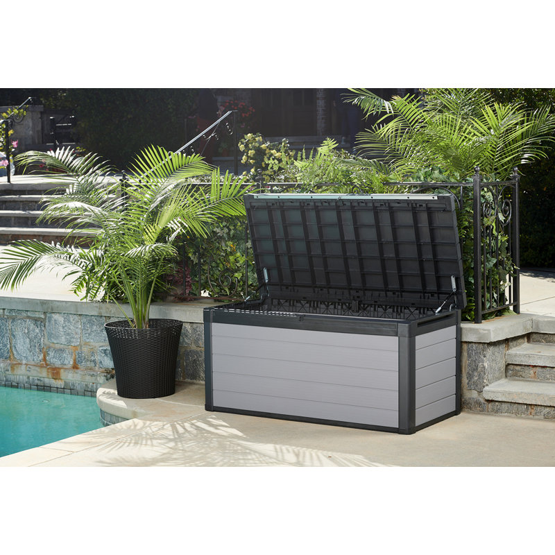 Boîte de terrasse avec rangement d'extérieur de 150 gallons en résine grise durable pour ranger les meubles et les fournitures en résine durable Premier de Keter