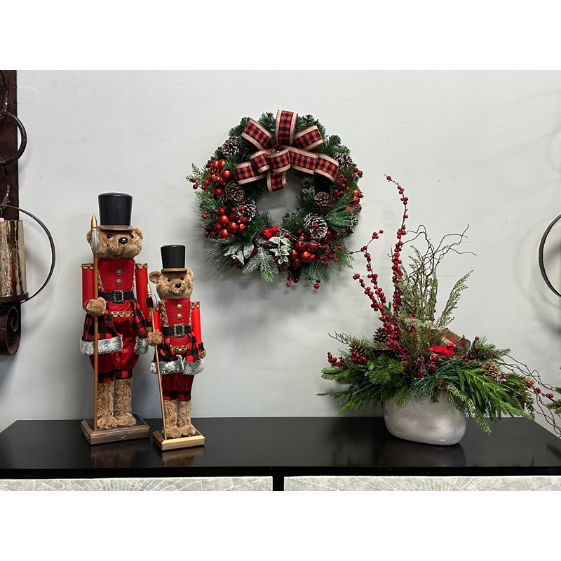 Holiday Centerpiece With Pine, Berries, Pinecones, And Decorative Bird