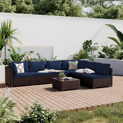 Forksville 7 Piece Rattan Sectional Seating Group with Cushions by Wade Logan