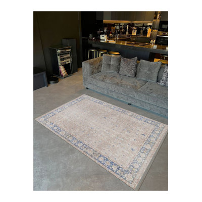 Tapis beige classique lavable à la machine à motif frontal classique bleu