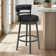 Deherrera Modern Swivel Counter or Bar Stool with Open Low Back and Footrest in Metal and Faux Leather