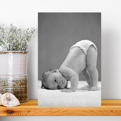 1950S Side View Of Portrait Baby In Diaper With Cheek To Floor And Bottom In Air Looking At Camera Classic Retro Vintage Dog Dolphin Portrait Wall Art