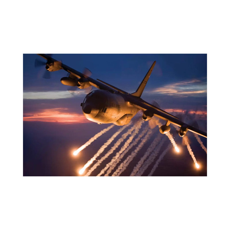 C-130 Hercules Releases Flares During A Mission Over Kansas by HIGH-G Productions - Wrapped Canvas Print