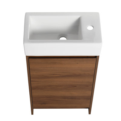Meuble-lavabo autoportant de 18 pouces avec lavabo simple. Portes d'armoire à fermeture en douceur sans effort. Lavabo en céramique. Contreplaqué brun ébène pour salles de bain compactes 18 po. Structure douce. Petits espaces de bain robustes